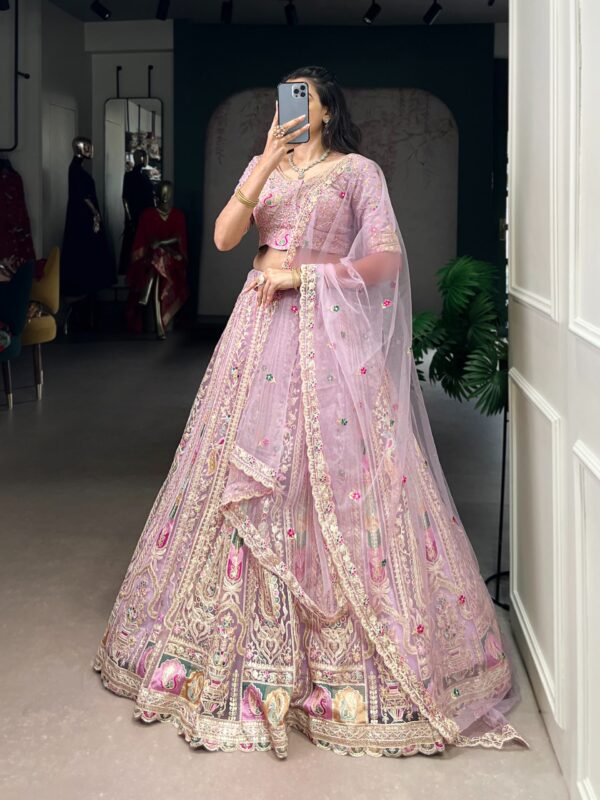 This pastel lehenga choli is a masterpiece of intricate embroidery and timeless elegance, crafted to make every celebration unforgettable 🤍💜 (072)